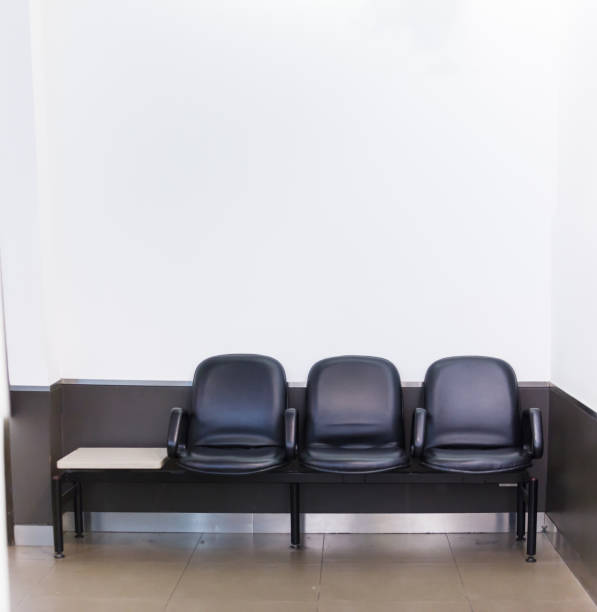 istock Black leather bench seat row on white wall background in waiting area. Architectural Home or Office Interior, House Furniture, Life and Living, Lifestyle, Decoration, Idea and Minimal Design concept 1124652297