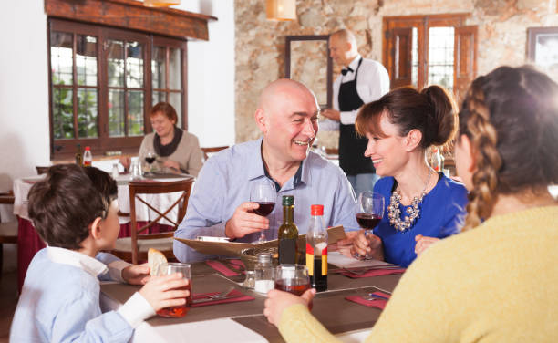 istock Happy family with boy at restaurant 1124652950