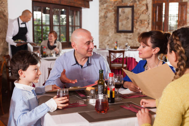 istock Family with little son at restaurant 1124652972