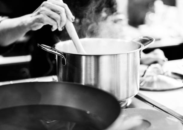 istock Chef cooking food in the kitchen, Chef preparing food 1124653342