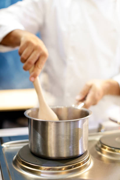 istock Chef cooking food in the kitchen, Chef preparing food 1124653349