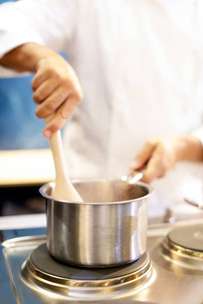 istock Chef cooking food in the kitchen, Chef preparing food 1124653357