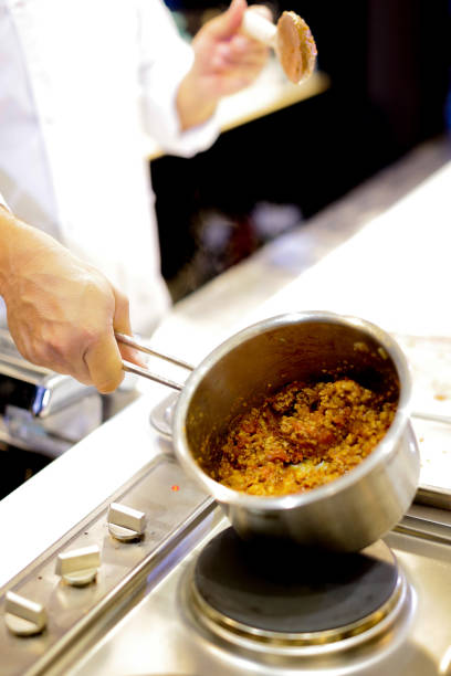 istock Chef cooking food in the kitchen, Chef preparing food 1124653358