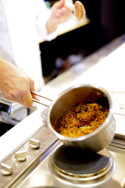 istock Chef cooking food in the kitchen, Chef preparing food 1124653361