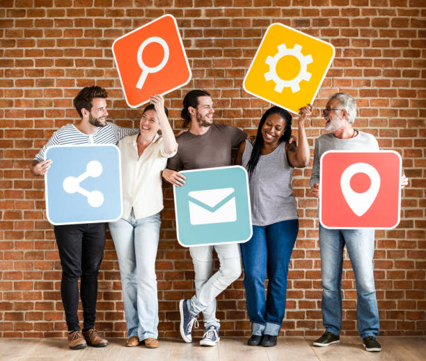 istock Diverse happy people with social networking icons 1124653603