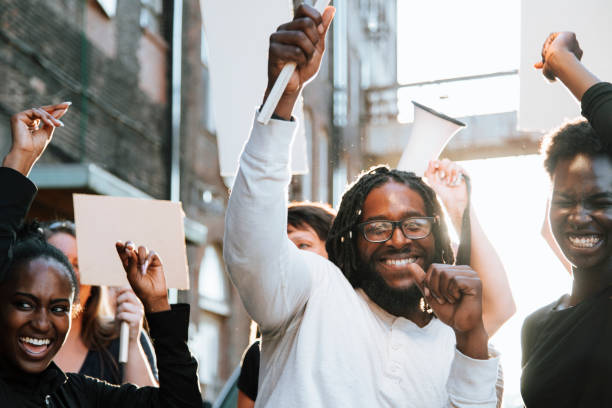 istock Happy activists marching through the city 1124657170