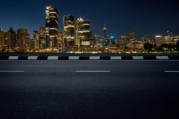 istock empty asphalt road with modern cityscape skyline in dusk 1124662015