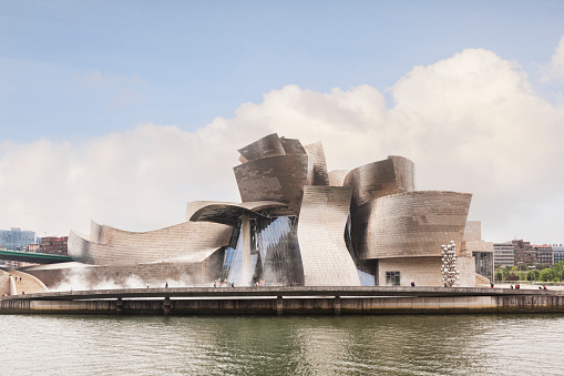 12 April 2015: Bilbao, Basque Country, Spain - The Guggenheim Museum by Frank Gehry on the banks of the River Nervion.