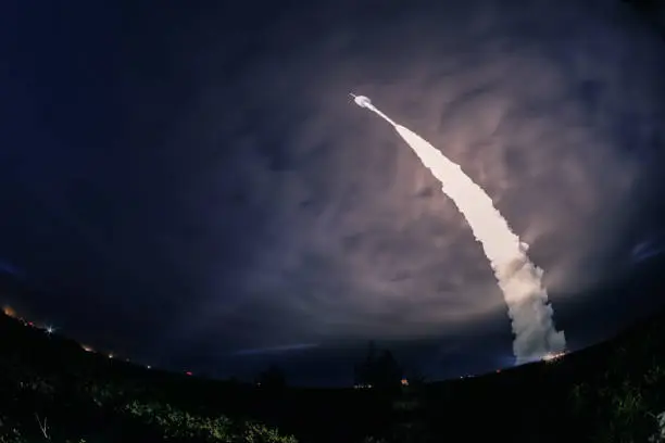 Photo of Missile launch at night. The elements of this image furnished by NASA.