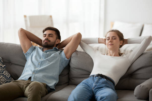 istock Calm lazy couple relaxing on comfortable sofa resting together 1124667798