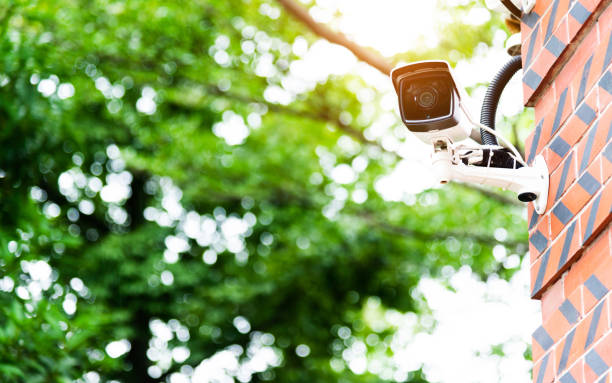 istock Security camera on the wall of residential building 1124668009