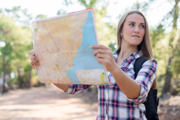 istock Female traveler lost in the forest 1124671895