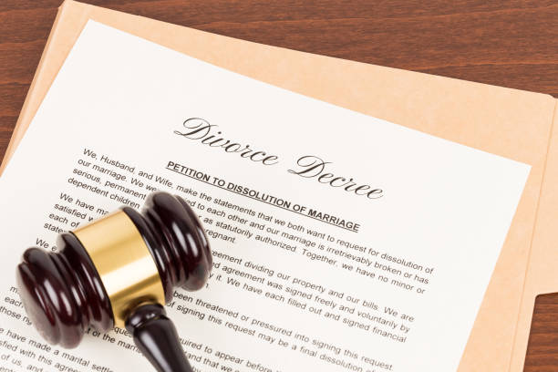 istock Wooden judge gavel and divorce decree; document is mock-up 1124672700