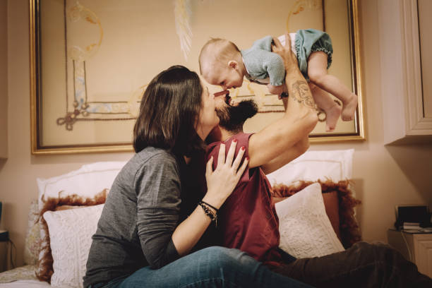 istock Family playing in bed 1124672775