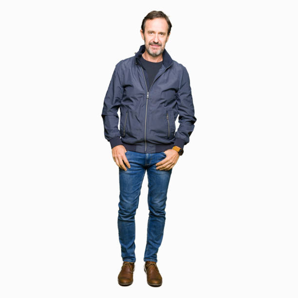 istock Middle age handsome man wearing a jacket Relaxed with serious expression on face. Simple and natural looking at the camera. 1124673110