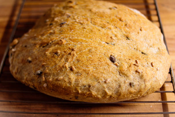 istock Delicious fresh bread on wooden background 1124678862