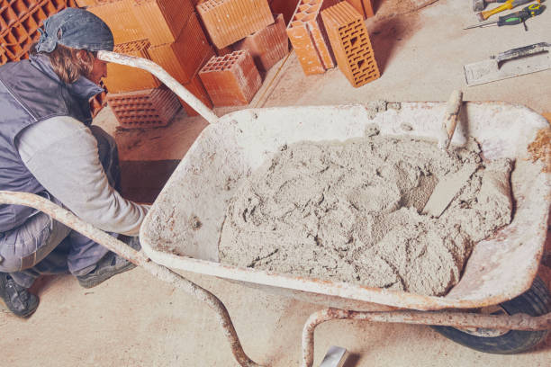 istock Real construction worker bricklaying the wall indoors. 1124679811