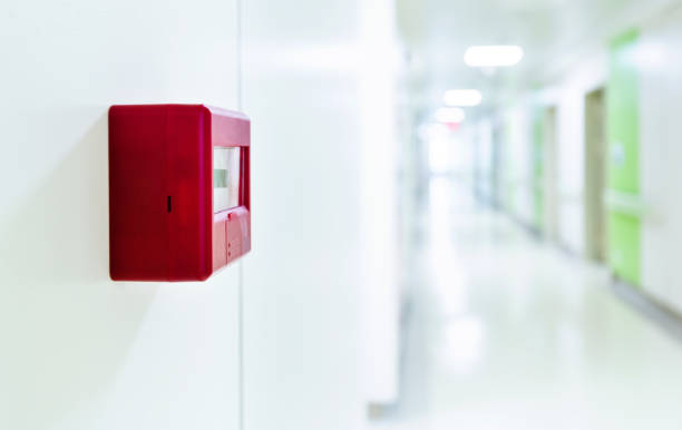 Red fire alarm on the wall of hospital Red fire alarm on the wall of hospital. school alarm stock pictures, royalty-free photos & images