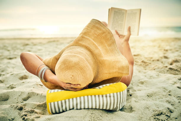 istock Relaxing on the beach with a good book 1124681206