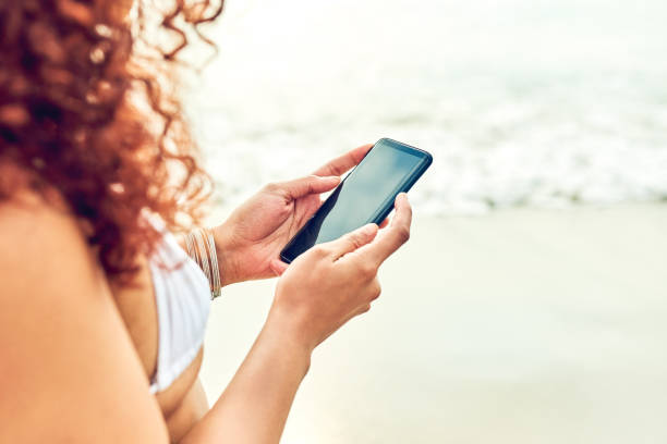 istock Inviting her friends to the beach 1124681215