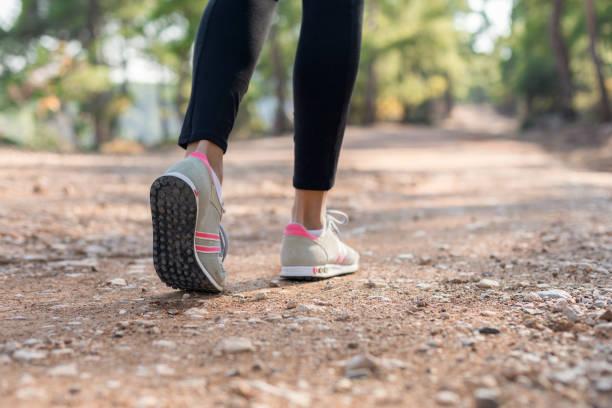 istock Woman walking in nature 1124681704