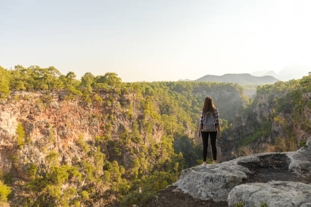 istock Young woman at canyon 1124683570