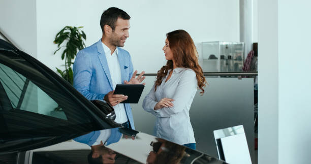 istock Car salesman with a customer 1124683665