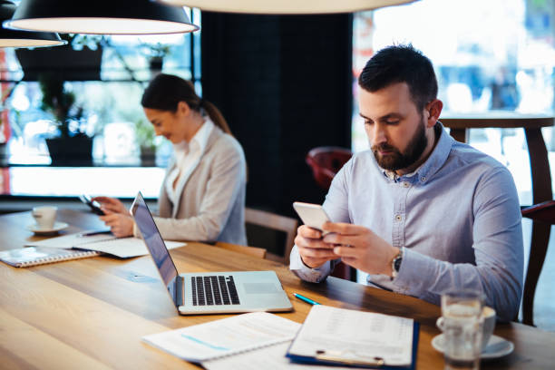 istock Businessman using mobile phone in the office 1124683852