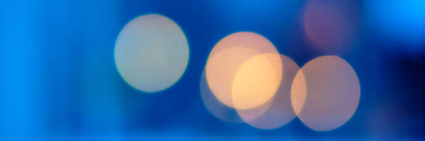 istock light colored spots of night illumination, urban environment. 1124685969