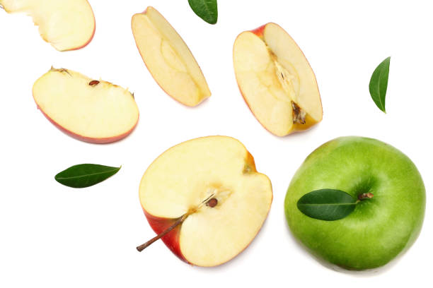 istock green and red apples with slices isolated on white background. top view 1124686025