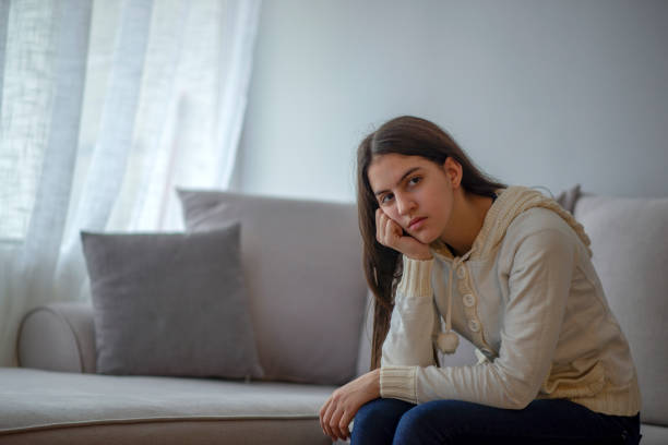 istock Bored girl in cafe texting 1124686796