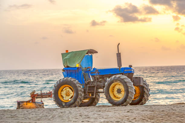 istock preparing the beach early morning with a tractor and a roller 1124686832