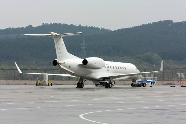 istock airplane parked in airport 1124689097