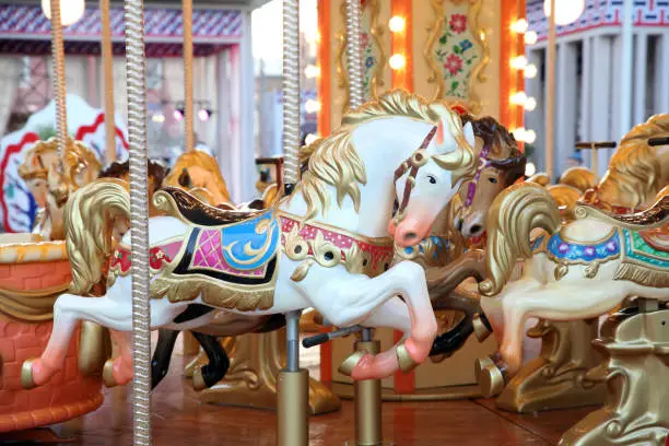 Photo of Children's carousel with horses at the festival