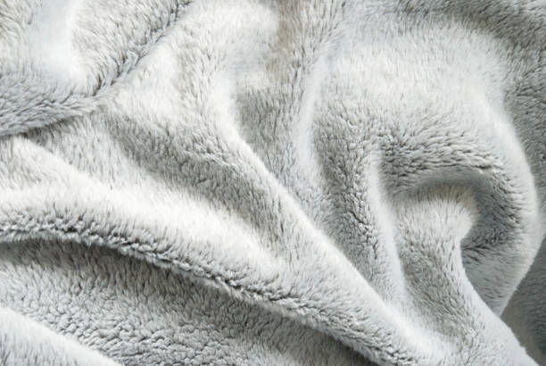 istock Close up white shaggy artificial fur texture or carpet for background 1124692459