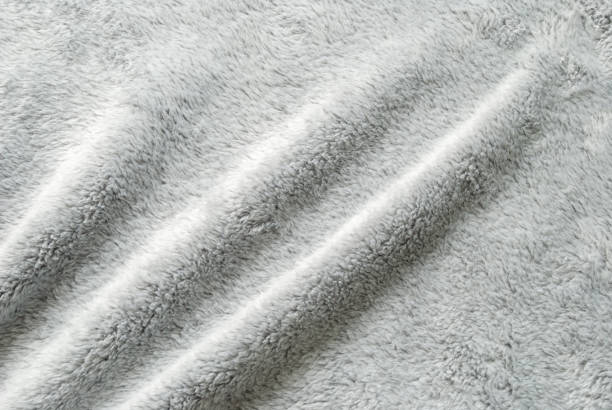 istock Close up white shaggy artificial fur texture or carpet for background 1124692511