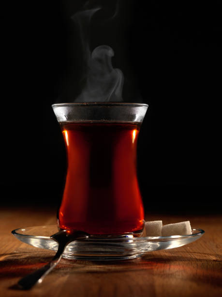 istock Hot Turkish tea with spoon and two sugars. 1124692776