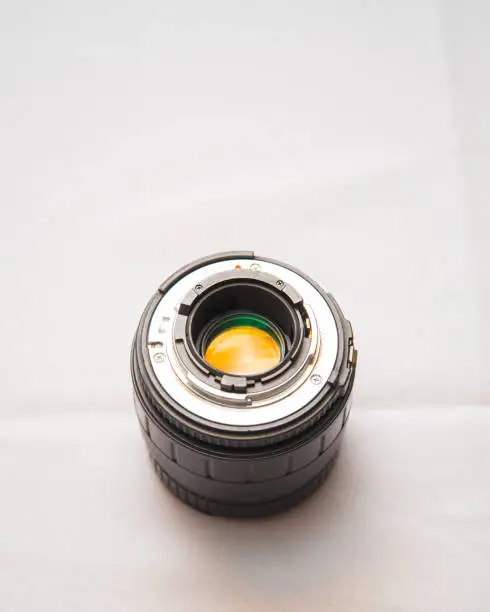 Photo of Photo lens from a SLR camera with beautiful colored glare on lenses