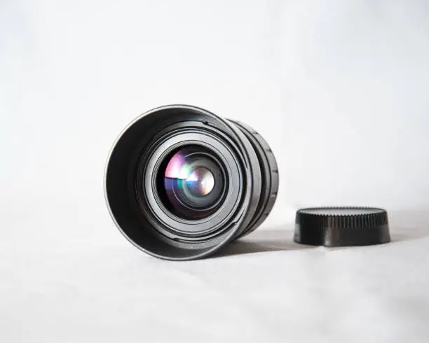 Photo of Photo lens from a SLR camera with beautiful colored glare on lenses