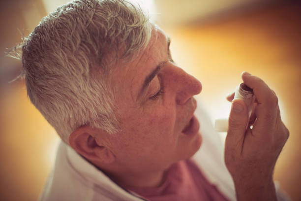 istock Seeking relief from his wheezing chest. 1124694311