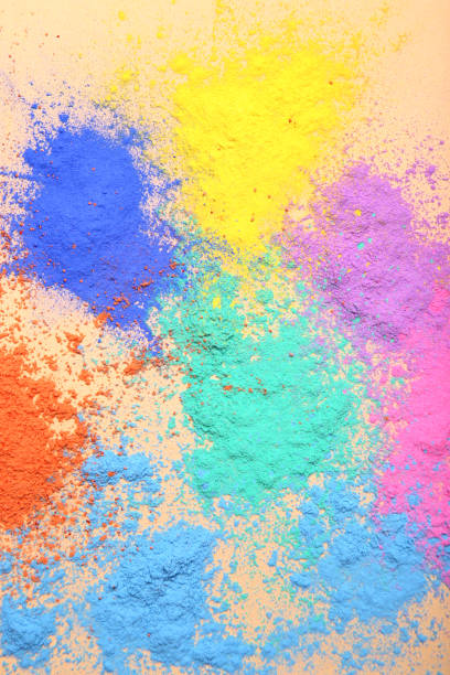 istock Colorful holi powders on beige background 1124695343