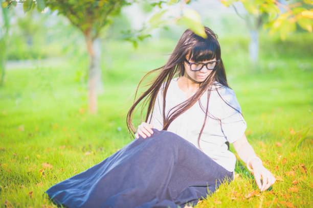 Chinese female college student siting on the campus