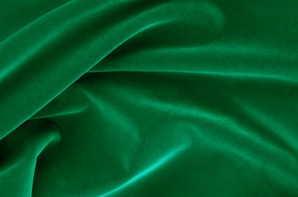 istock Abstract Flowing Wavy Green Satin Fabric 1124696066