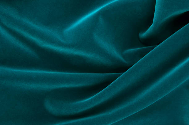 istock Abstract Flowing Wavy Green Satin Fabric 1124696071