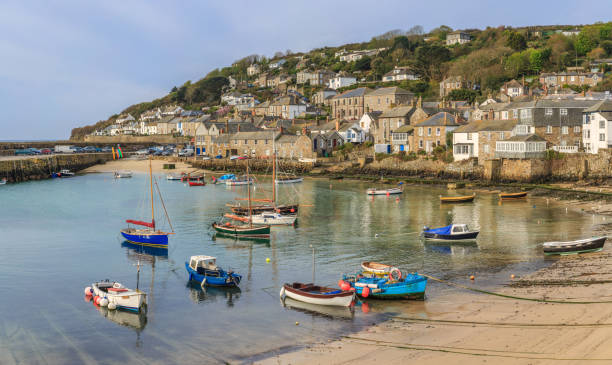istock Boats Moored at Low Tide, Mousehole Harbour, Cornwall 1124696106