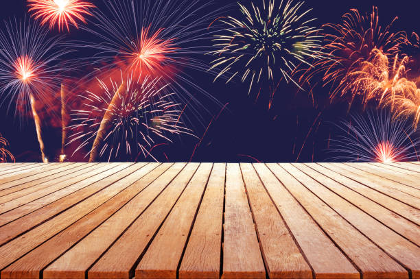 istock fireworks background for celebration design with wooden table top for advertise 1124696281