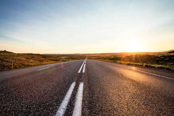 istock Straight asphalt road against sky in Iceland 1124696347