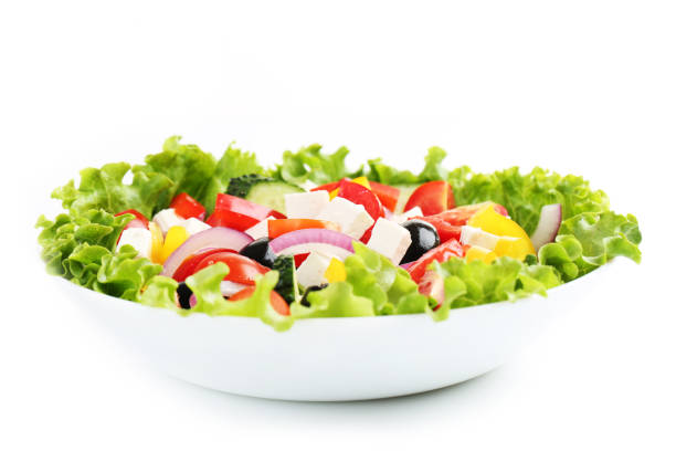 istock Vegetable salad in bowl isolated on white background 1124697233