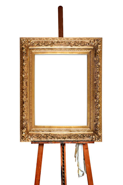 istock Painter's easel and empty antique golden frame 1124699525