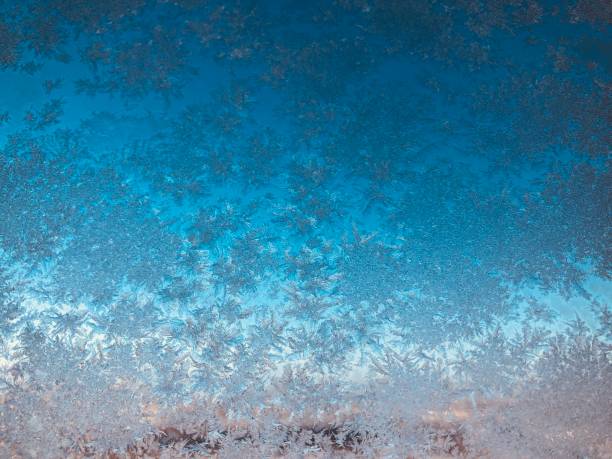 istock Frosted water crystal on glass window in sunny day 1124699751